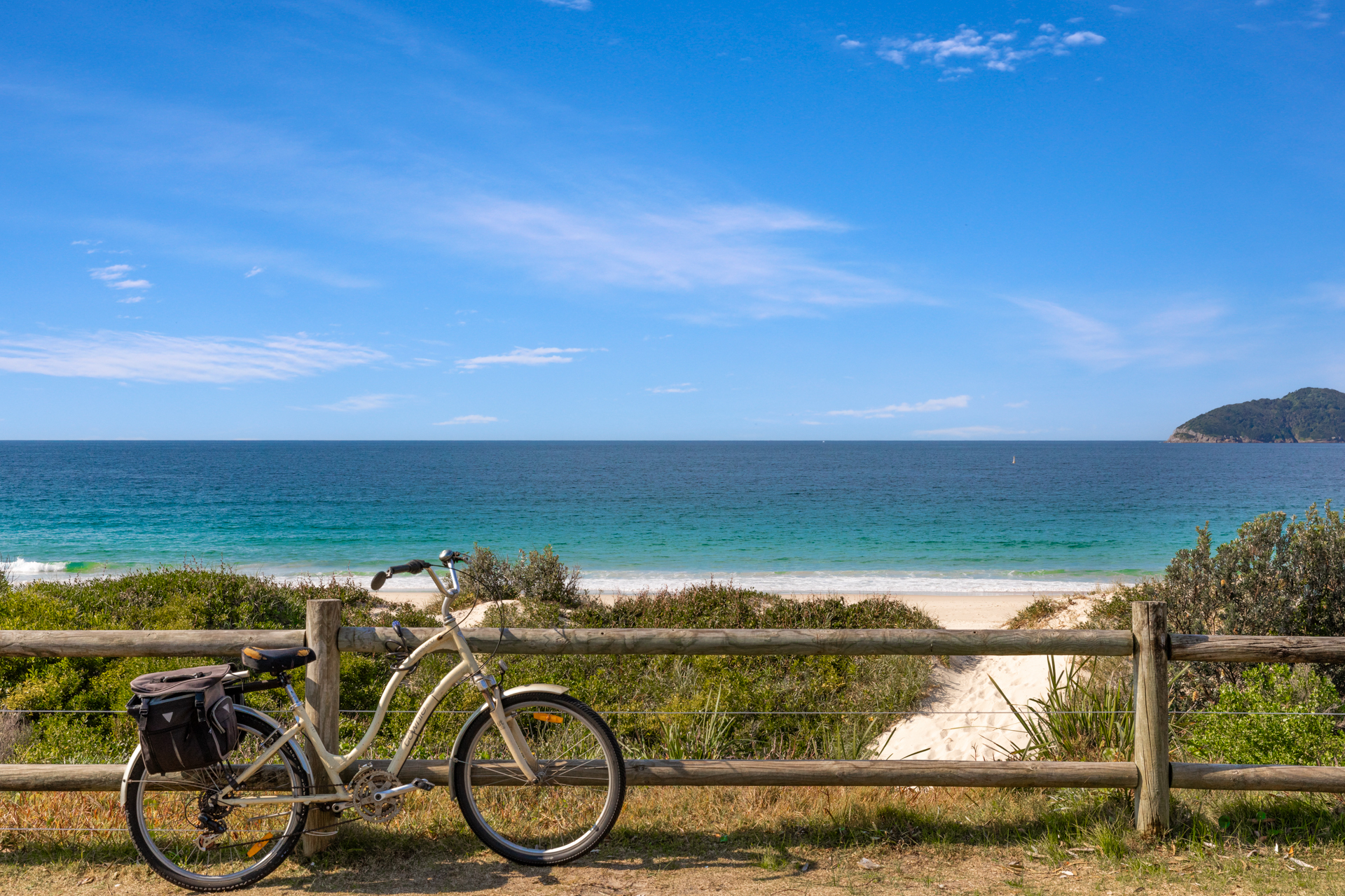 Bike at the beach fence